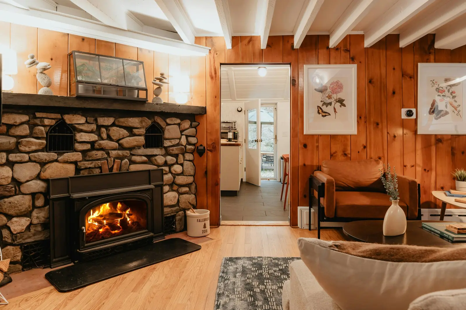 A stone fireplace in a wood-paneled Utah room